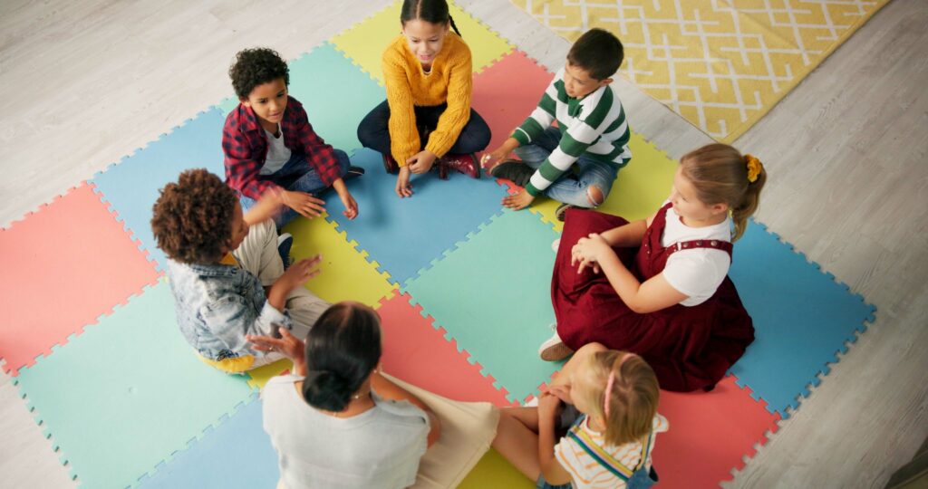 Kindergarten, children and hands with game in circle for development, growth and activity. Teacher,.